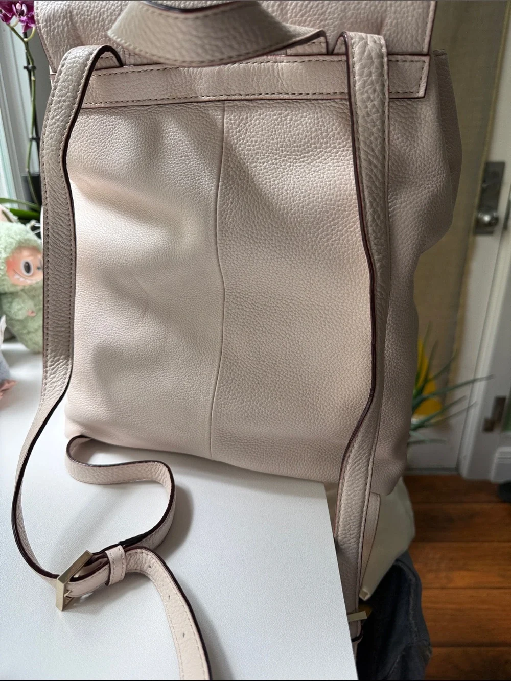 kate spade Pebbled Cream Leather Backpack with Tassel Accents